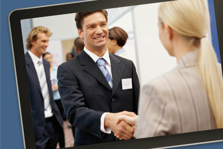 Man shaking a woman's hand displayed on tablet screen