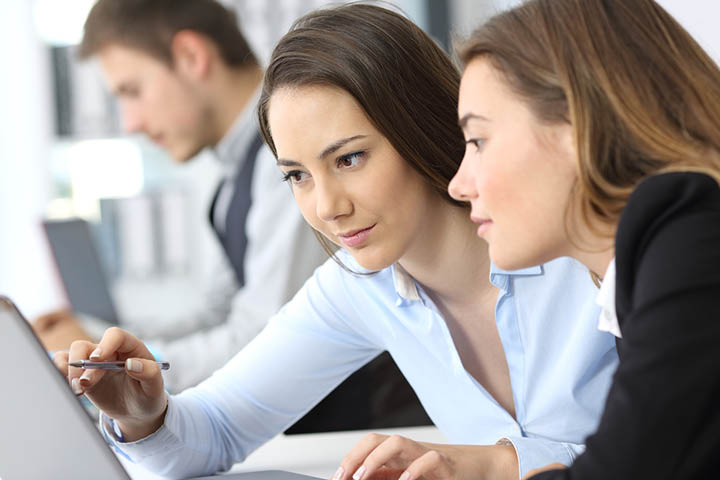 Two woman working together